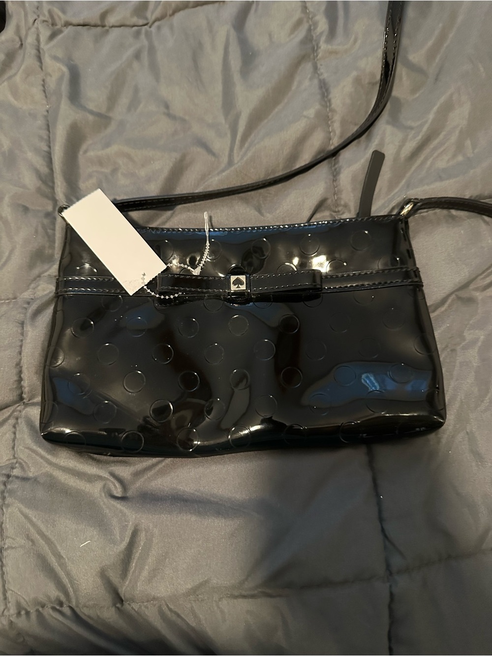 kate spade Black Patent Dot-Embossed Crossbody with Bow Accent story book inside